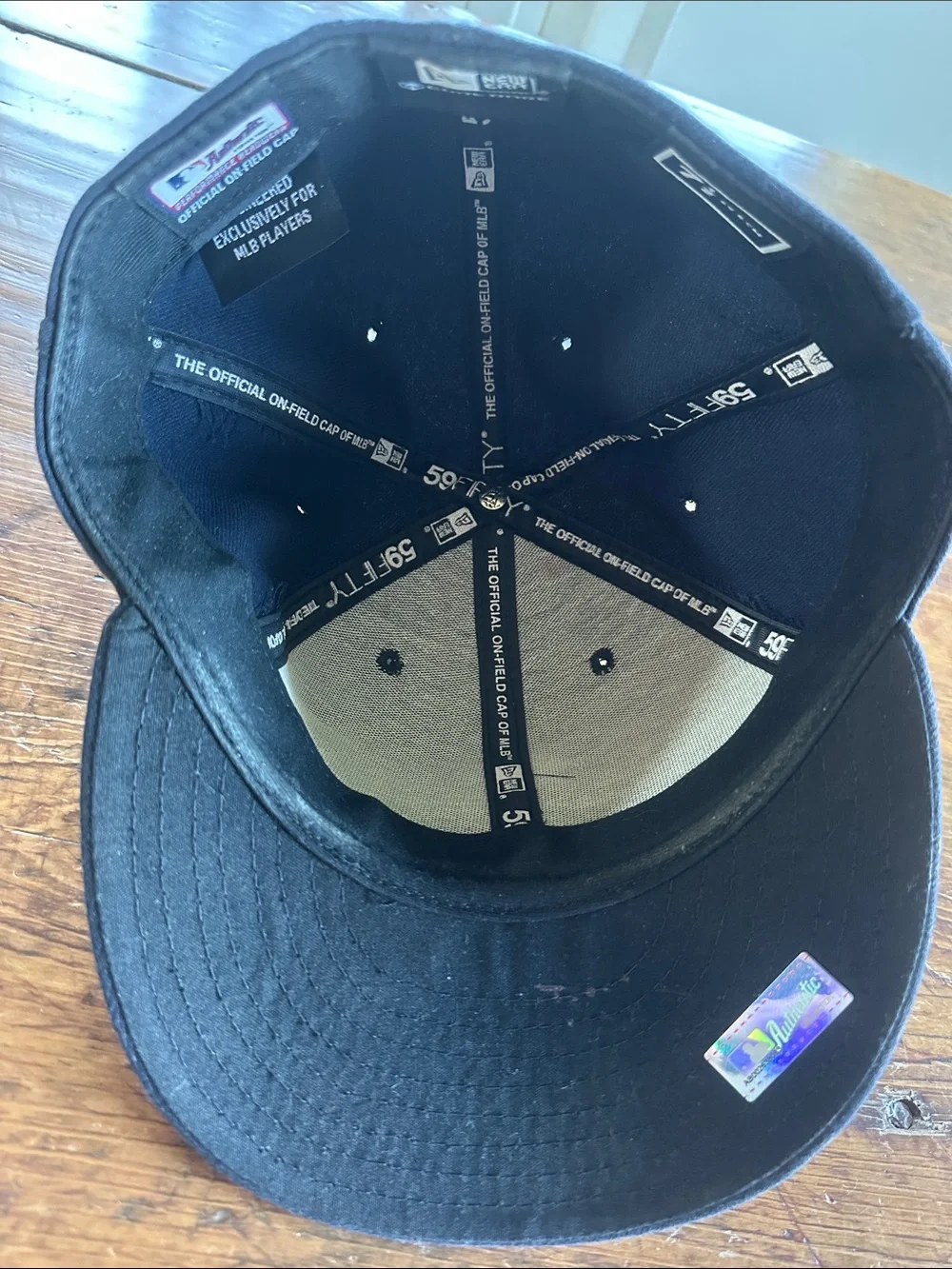 New Era Mariners Navy Blue Snapback with Teal & Silver Logo